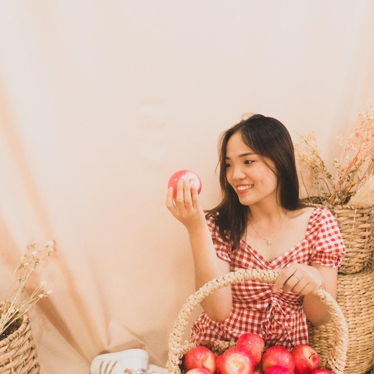 Alex Chen, Lead Design Curator at Quiet Mountain Network, reviewing corporate floral arrangements